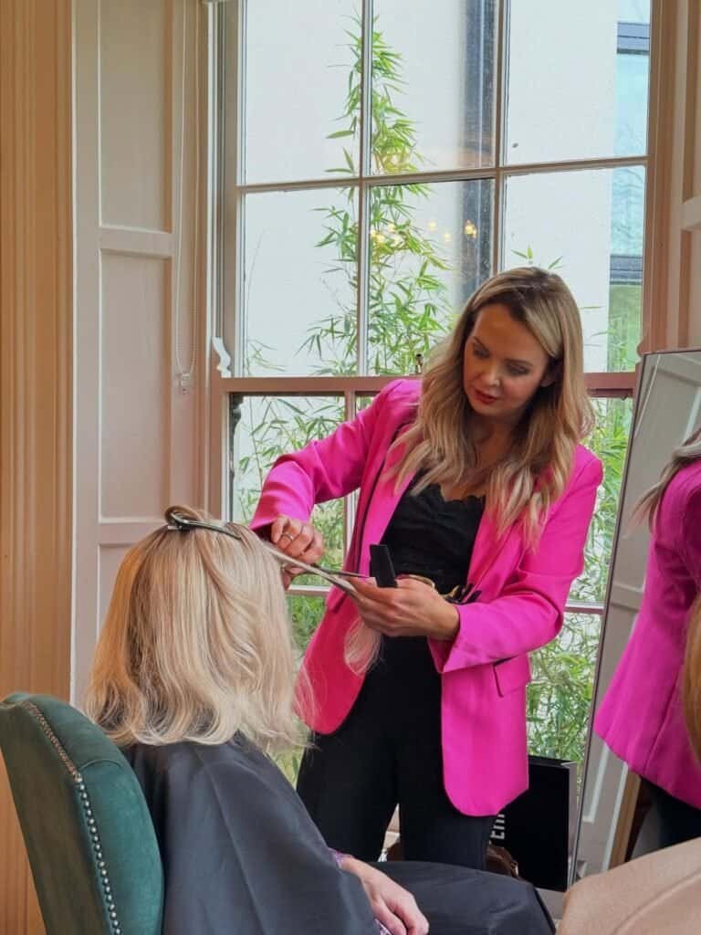 KHG Hair Enhancers stylist fitting a hair enhancer at a roadshow event in Ireland